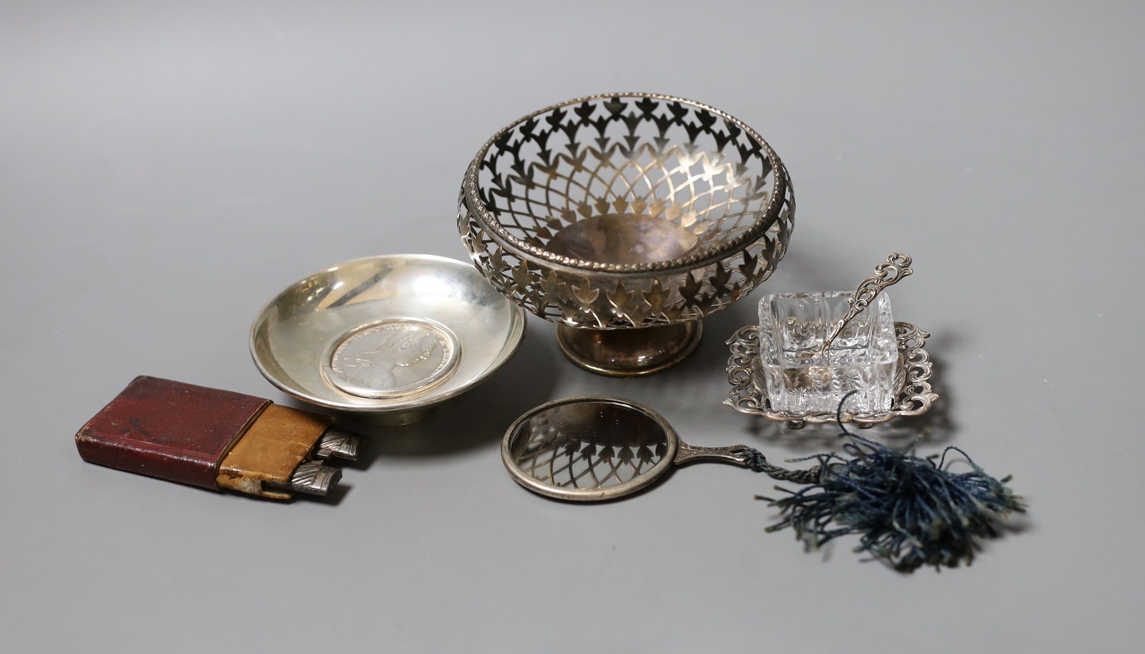 A cased Georgian silver and mother of pearl mounted campaign knife and fork, a pierced silver bonbon dish and other minor silver.